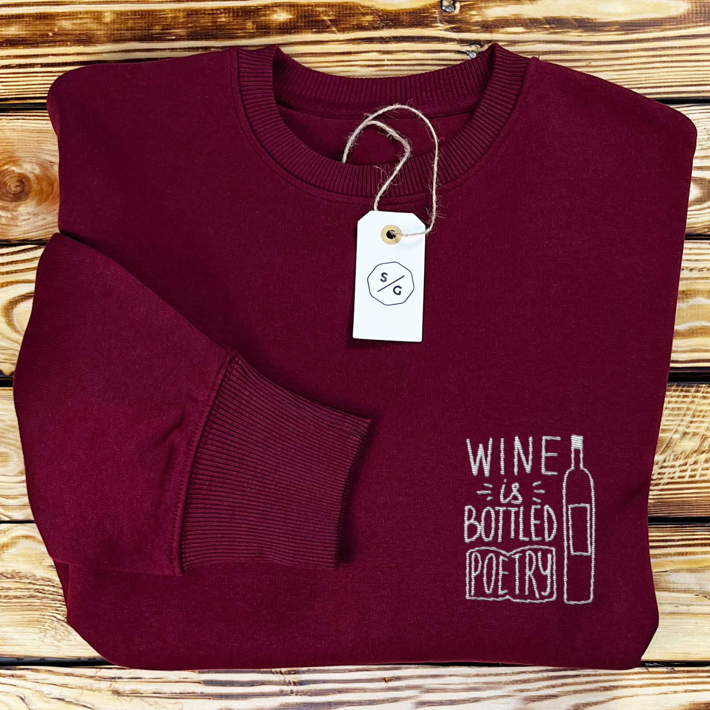 BESTICKTER SWEATER • WINE IS BOTTLED POETRY