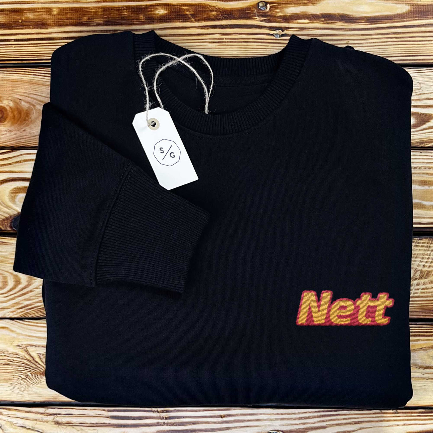 EMBROIDERED SWEATER • NETT 