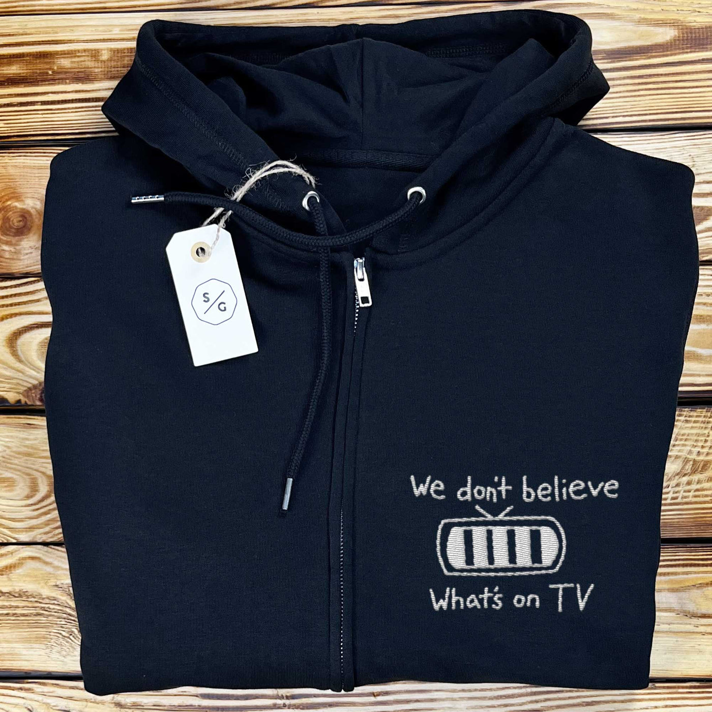 BESTICKTER ZIPPER HOODIE • WE DON'T BELIEVE WHAT'S ON TV